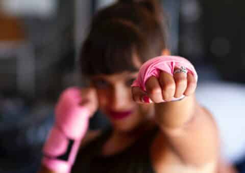 Woman in pink boxing gloves